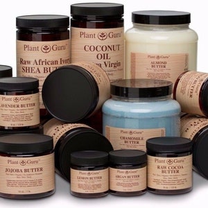 May include: A collection of 11 brown glass jars with black lids containing various butters and oils. The jars are labeled with the brand name "Plant Guru" and the type of butter or oil, such as "Avocado Butter", "Raw African Ivory Shea Butter", and "Coconut Oil".