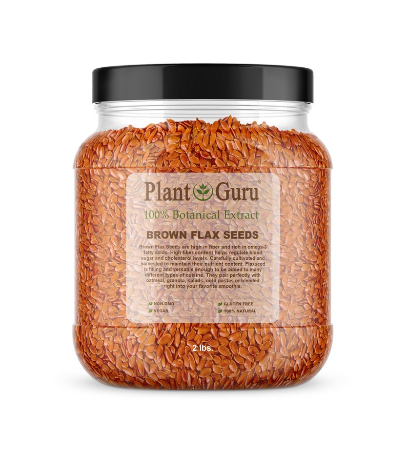 May include: A clear glass jar filled with brown flax seeds. The jar has a black lid and a label that reads "Plant Guru 100% Botanical Extract Brown Flax Seeds". The label also includes information about the product, such as "Non-GMO, Vegan, Gluten Free, 100% Natural". The jar contains 2 pounds of flax seeds.
