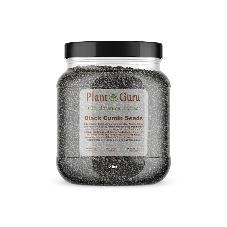 May include: A clear plastic jar filled with black cumin seeds, labeled "Plant Guru 100% Botanical Extract Black Cumin Seeds." The jar has a black lid and a label with text about the seeds' health benefits. The jar contains 2 lbs of seeds.