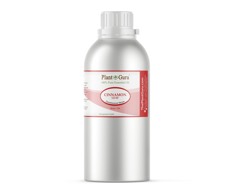 May include: A large, silver metal bottle of cinnamon leaf essential oil. The label reads "Plant Guru 100% Pure Essential Oil" and "Cinnamon Leaf". The bottle contains 16 fl oz / 1 lb of oil.