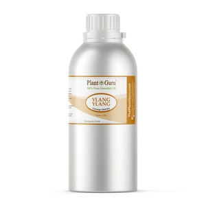 May include: A large, silver metal bottle of Ylang Ylang essential oil. The label features the text "Plant Guru 100% Pure Essential Oil" and "Ylang Ylang Cananga Odorata". The bottle contains 16 fl oz / 1 lb of oil.