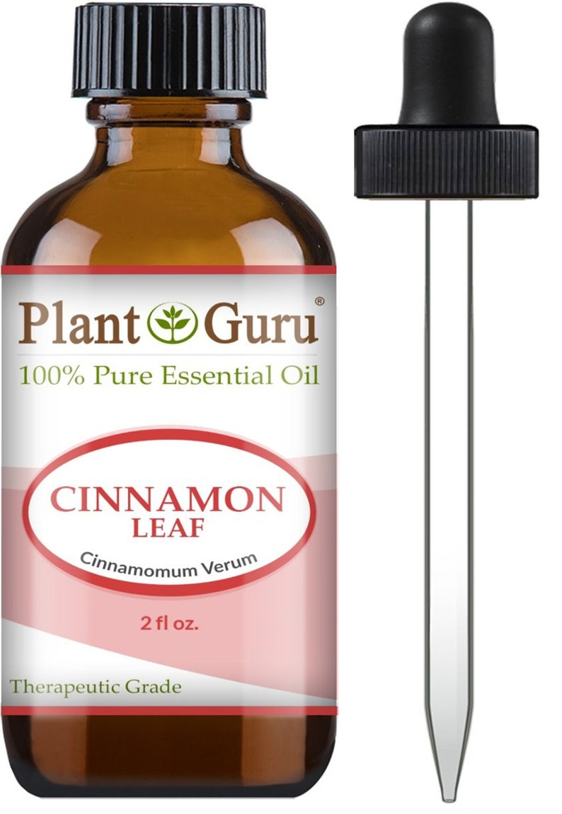 May include: A brown glass bottle of Plant Guru Cinnamon Leaf essential oil with a black dropper. The label reads "100% Pure Essential Oil" and "Cinnamon Leaf, Cinnamomum Verum, 2 fl oz." The product is labeled as "Therapeutic Grade."