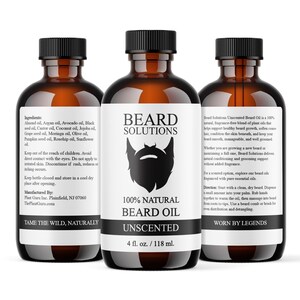 May include: Three brown glass bottles of Beard Solutions 100% Natural Unscented Beard Oil. Each bottle has a black cap and a white label with a black beard graphic. The bottles contain 118 ml of oil.