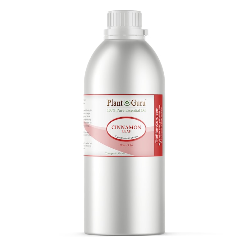 May include: A large, silver metal bottle of Plant Guru Cinnamon Leaf essential oil. The label is red and white, with the text "CINNAMON LEAF" and "32 oz. / 2 lbs.". The bottle has a white cap.