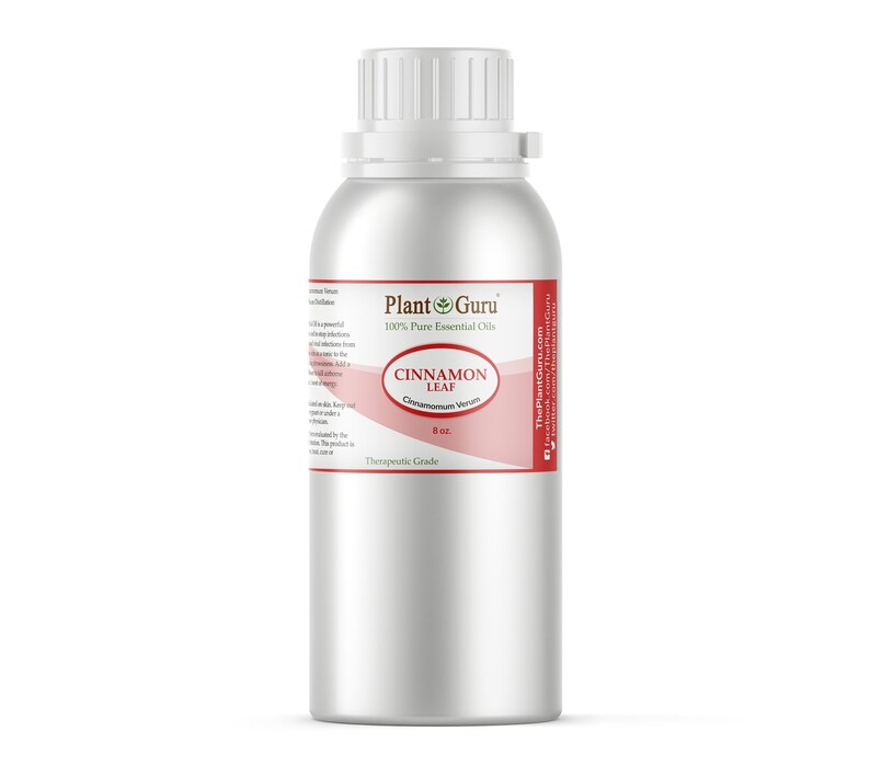 May include: A silver metal bottle of cinnamon leaf essential oil. The label reads "Plant Guru 100% Pure Essential Oils" and "Cinnamon Leaf Cinnamomum Verum 8 oz." The bottle has a white cap and a red and white label.