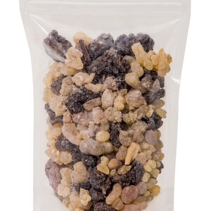 May include: A clear plastic resealable bag filled with a mixture of brown, tan, and light brown resin pieces.