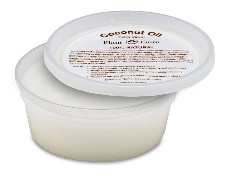 May include: A white plastic container with a white lid. The lid has a brown label that reads "Coconut Oil Extra Virgin Plant Guru 100% Natural". The label also includes a list of uses and benefits of coconut oil.