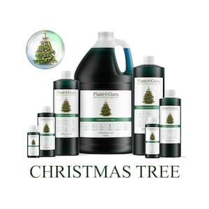 May include: Various sizes of dark green liquid bottles and jugs with white labels featuring a Christmas tree graphic. The text "Plant Guru" and "Christmas Tree" are visible. A small, decorative snow globe with a Christmas tree is also present.