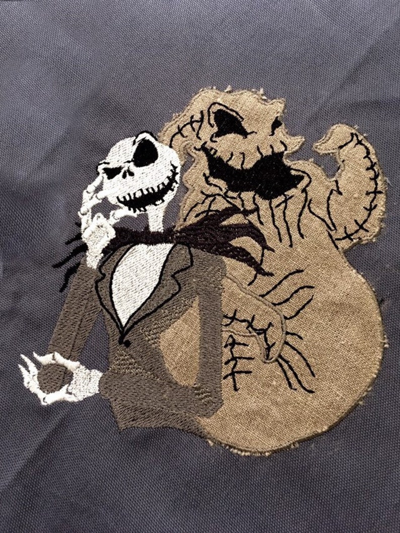 May include: Embroidered patch featuring Jack Skellington and the Boogie Man from The Nightmare Before Christmas. The patch is brown and black on a gray background.
