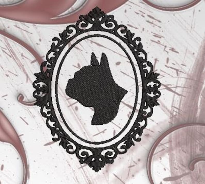 K&ouml;nnte beinhalten: Schwarze Silhouette eines Katzenkopfes in einem dekorativen ovalen Rahmen. Der Rahmen hat ein schwarz-wei&szlig;es Design.