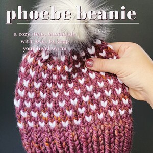 May include: A cozy knitted beanie with a white pom pom. The beanie is a burgundy color with white and orange flecks. The beanie has a white chevron pattern.
