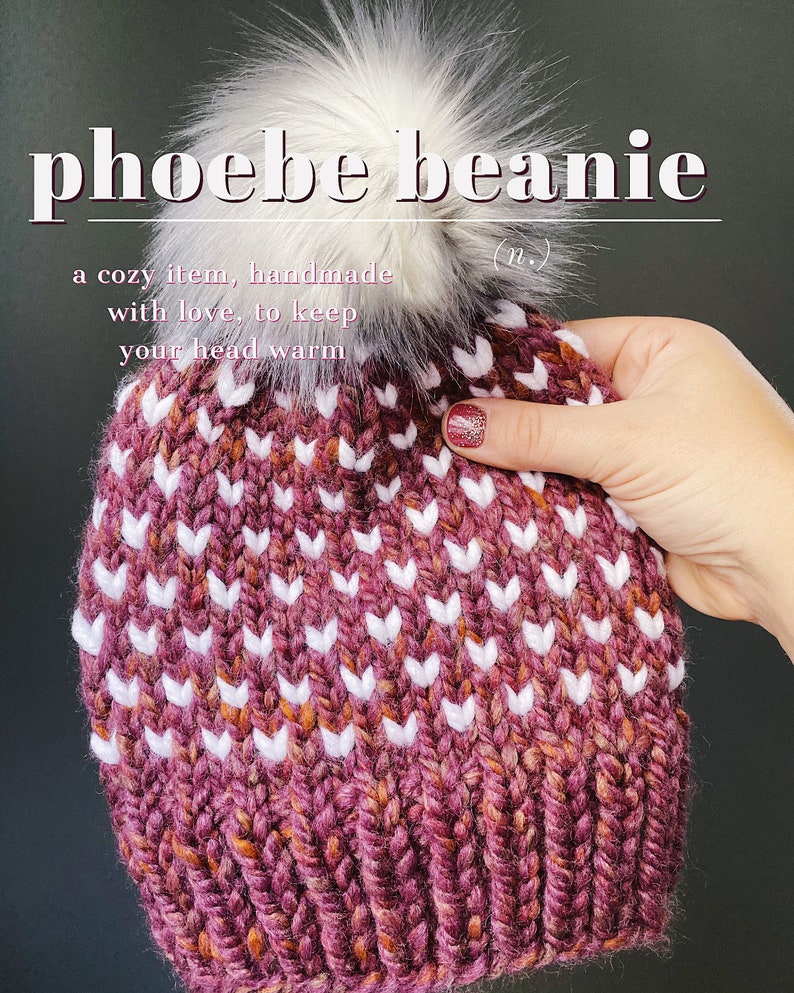 May include: A cozy knitted beanie with a white pom pom. The beanie is a burgundy color with white and orange flecks. The beanie has a white chevron pattern.