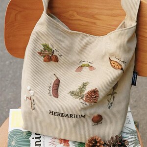 Kit de materiales para hacer tú mismo: bolso de pana con diseño de piña, delantal bordado, kit para principiantes, kit hecho a mano para tela/pintura, broche, kit de regalo de Navidad.