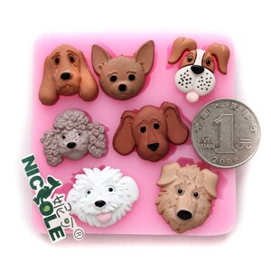 May include: Pink silicone mold with seven different dog head designs. The mold is used for making fondant or gum paste decorations for cakes and cupcakes.