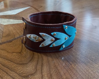 Dark Brown Leather Wrist Cuff with Varying Shades of Turquoise Leaves Gold Rivets and Snaps