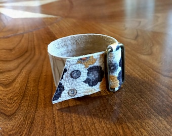 Wrist Cuff with Adjustable Brass Slider Brass Rivets White, Black and Yellow Floral Leather