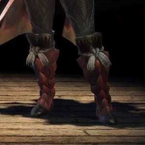 May include: Red and brown leather boots with white straps and buckles. The boots have a pointed toe and a high heel.
