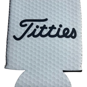 May include: White double-sided can cooler with black text that says "Titties" and "DOUBLE SIDED".