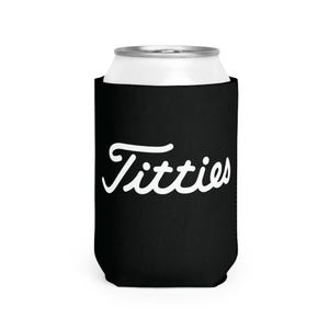 May include: Black can cooler with white cursive text that reads "Titties".