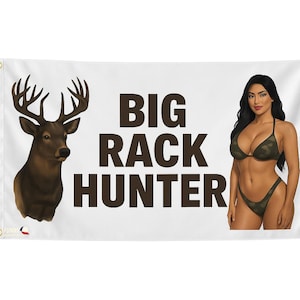 May include: White banner with the text "BIG RACK HUNTER" in dark brown. The banner features a deer head on the left and a woman in a camouflage bikini on the right.
