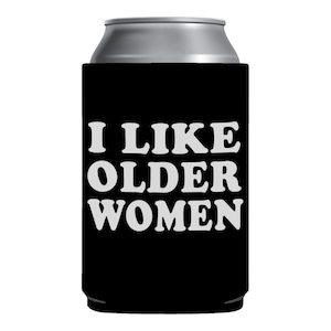May include: Black can cooler with white text that reads "I like older women".
