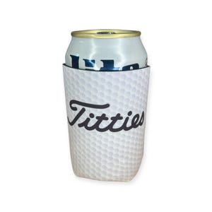 May include: White golf ball can cooler with black text that says "Titties".
