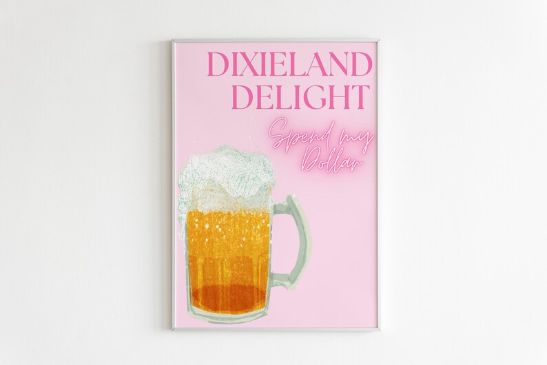 May include: A pink poster with the text "Dixie Land Delight" and "Spend my Dollar" in pink neon lettering. A glass of beer with a white head is in the center of the poster.