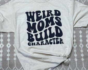 Weird moms build character graphic tee shirt