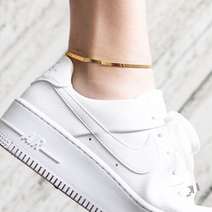 Nike anklet hot sale gold