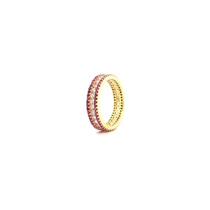 May include: A gold band ring with a double row of clear cubic zirconia stones and a single row of red cubic zirconia stones.