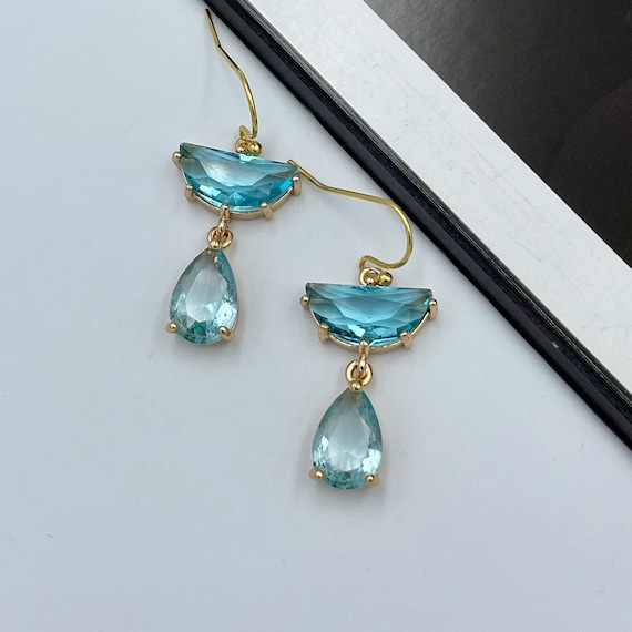 Platinum plated fancy cut cz earrings with aqua blue drops -