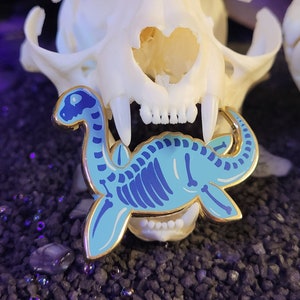 Plesiosaurus - Plessi Enamel Pin Skeleton candy themed lapel pin blue skull gold metal screenprint kawaii small
