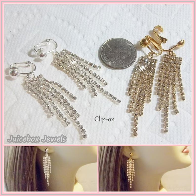 May include: Two pairs of clip-on earrings with dangling crystal strands. The earrings are silver and gold toned. The earrings are shown on a white background and on a model's ear.