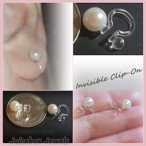 May include: A pair of white pearl clip-on earrings with clear plastic backs. The earrings are shown on a hand and next to a US quarter for size comparison. The text "Invisible Clip-On" is visible in the image.