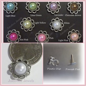 May include: Assortment of pearl and colored glass flower-shaped embellishments with silver settings. The embellishments are displayed on a white background with the text "Juicebox Jewels" and the color names of each embellishment.  The embellishments are available in light blue, lime green, lavender, chocolate brown, light yellow, white, hot pink, pink, and light pink.  The image also shows a close-up of a single embellishment with a white pearl and a silver setting, a plastic clip, and a pierced post.