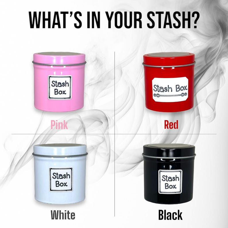May include: Four metal tins in different colors: pink, red, white, and black. Each tin has a white label with the text "Stash Box" printed on it. The tins are arranged in a grid pattern on a white background.