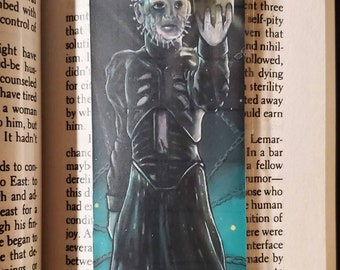 Hellraiser Pinhead with puzzle box, laminated bookmark with tassel.