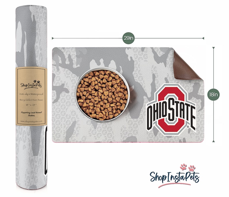 May include: A gray and white camouflage pet food mat, 29 inches long and 18 inches wide, with the Ohio State logo and a bowl of pet food. The mat is anti-slip, waterproof, and recyclable. The rolled-up matching mat is also visible.