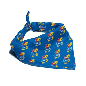 May include: Blue bandana with a repeating pattern of a yellow and red bird mascot with the letters "KU" on its chest.