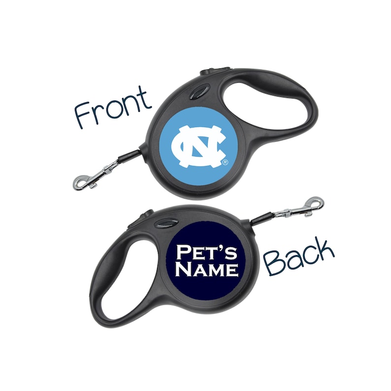 May include: A black retractable dog leash with a blue and white UNC Tar Heels logo on the front and the text "PET'S NAME" on the back.