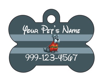 May include: A gray bone-shaped dog tag with a cartoon dog wearing a red and green sweater. The tag says "Your Pet's Name" and "999-123-4567".
