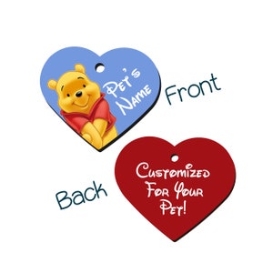 May include: A heart-shaped pet tag with a blue background and a picture of Winnie the Pooh. The text "Pet's Name" is on the tag. The back of the tag is red and says "Customized For Your Pet!"