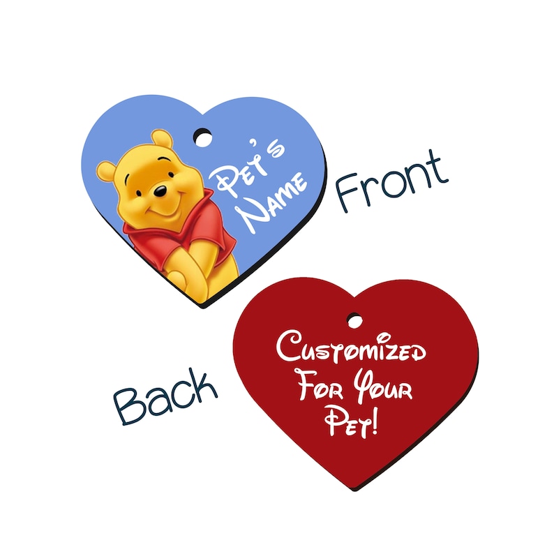 May include: A heart-shaped pet tag with a blue background and a picture of Winnie the Pooh. The text "Pet's Name" is on the tag. The back of the tag is red and says "Customized For Your Pet!"