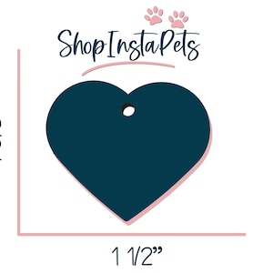 May include: A dark blue heart-shaped tag with a hole for a ring or string. The tag measures 1 1/2 inches wide and 1 5/8 inches tall. Shop Insta Pets is written in pink script above the tag.