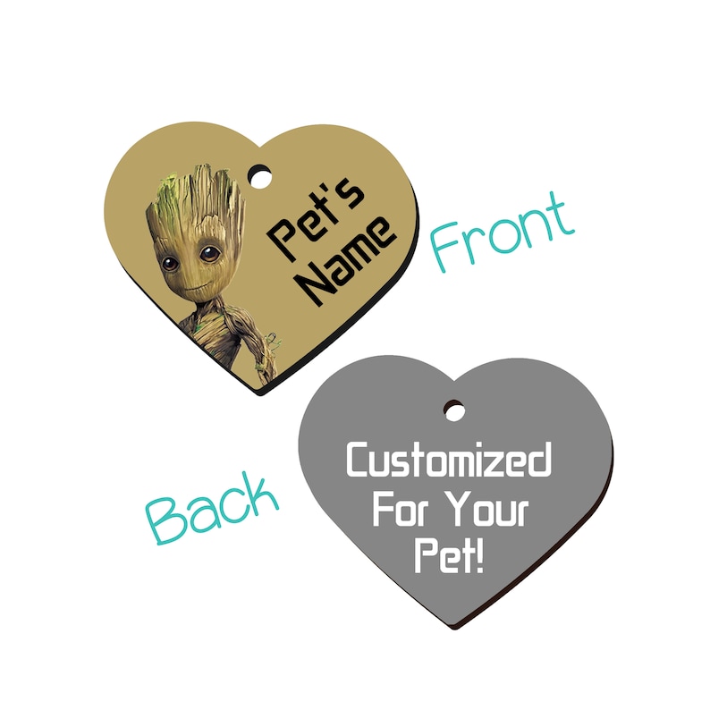 May include: Heart-shaped pet tag featuring a cartoon character on a tan background. The front says "Pet's Name" and the back says "Customized For Your Pet!" in white on a gray background. A hole is at the top for attachment.