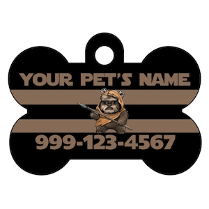 May include: Black and brown bone-shaped dog tag with a cartoon image of a Star Wars character, a phone number, and the text "YOUR PET'S NAME".