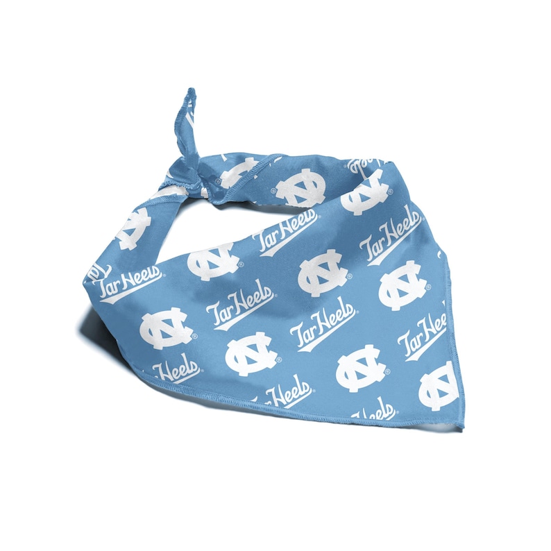 May include: A light blue bandana with a white repeated pattern of the University of North Carolina Tar Heels logo and the words "Tar Heels".