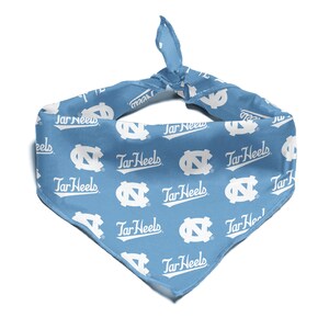 May include: A light blue bandana with a white repeated pattern of the University of North Carolina Tar Heels logo and the words "Tar Heels".
