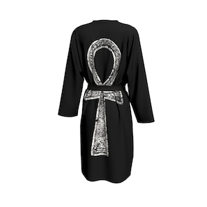 May include: Black robe with a white Ankh symbol printed on the back. The robe has a black belt.