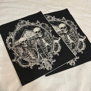 May include: Two skeletons in a spooky, ornate frame with a house in the background. The image is in black and white and has a distressed look.